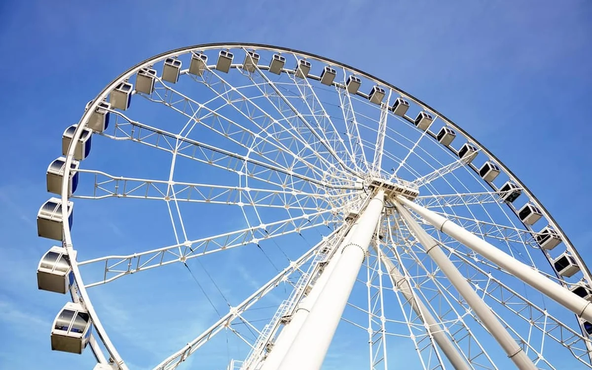 La Grande Roue de Montréal observation wheel lit up in the Old Port